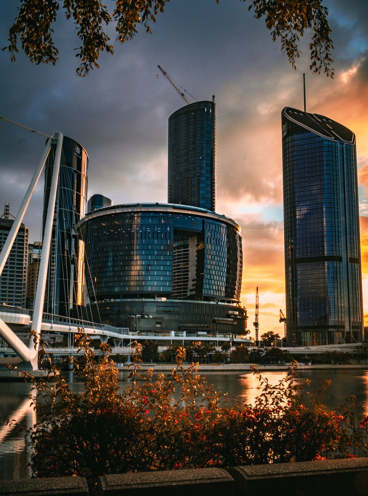 Brisbane skyline beside the river at sunset