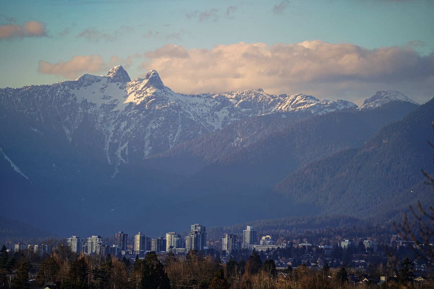 Vancouver skyline across the water with mountains beyond