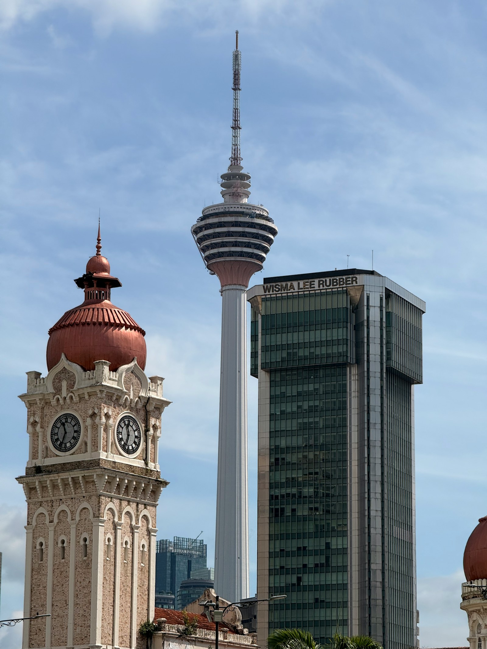 Historic Sultan Abdul Samad clock tower and KL Tower in Kuala Lumpur