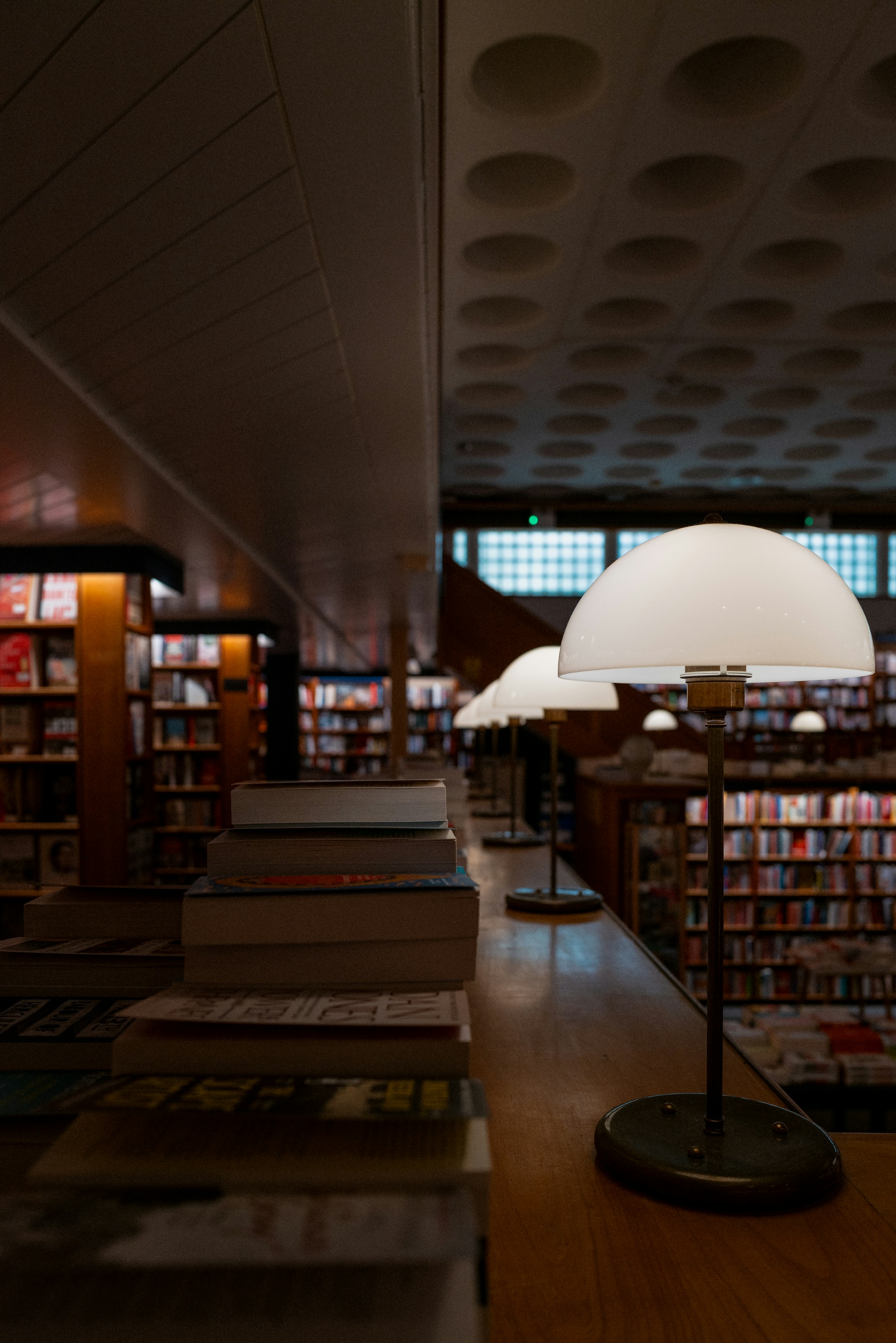 A warmly lit university library and study space