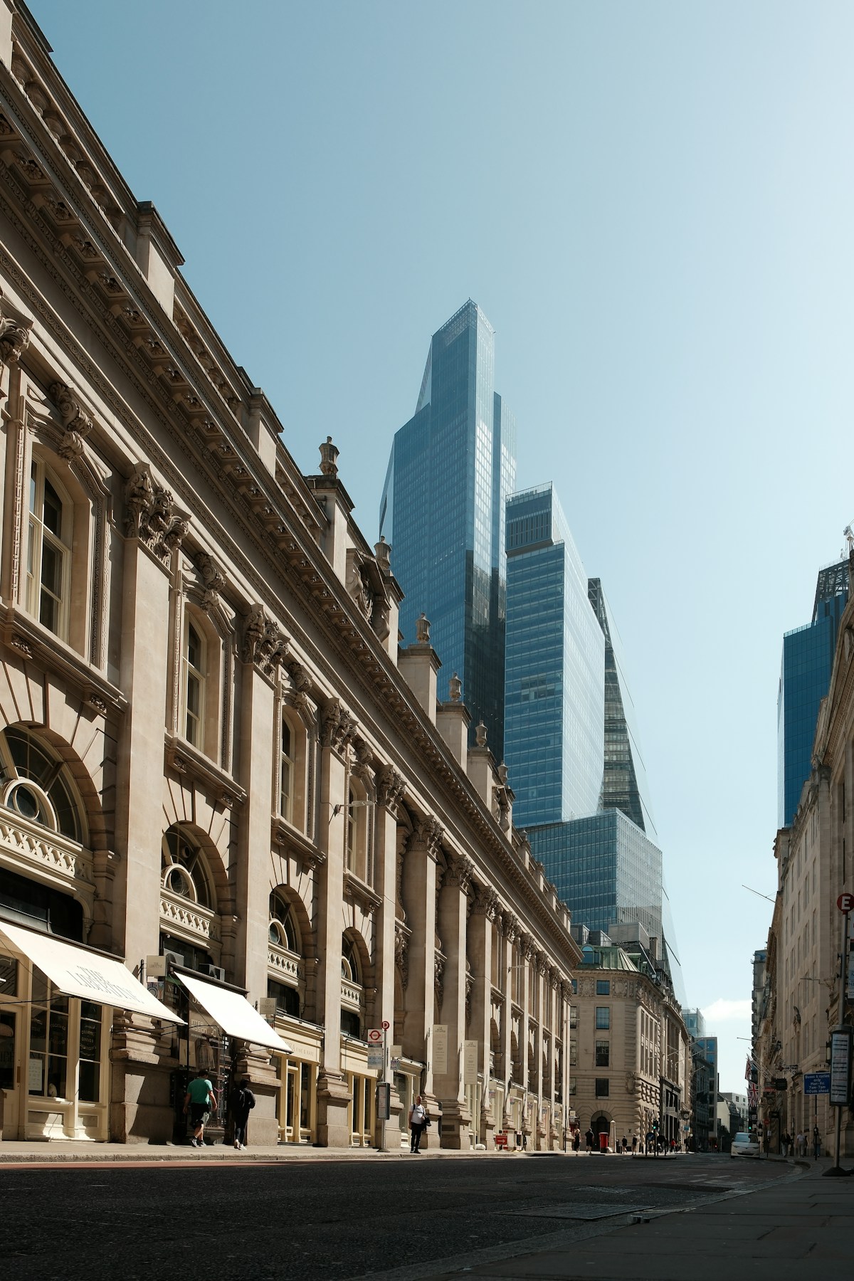 A London street framed by modern city buildings