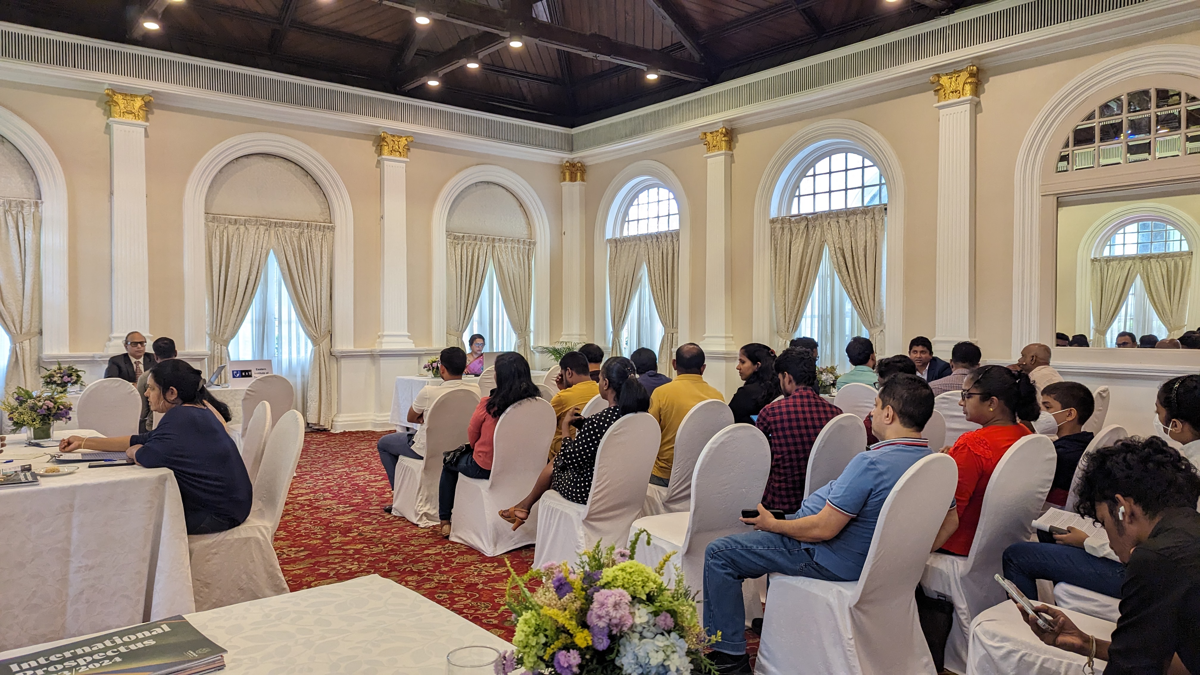 Students and parents seated in an ornate colonial ballroom attending the EIT information session at Taj Samudra, Colombo